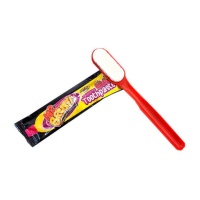 Escova de dentes com pasta de dentes de caramelo